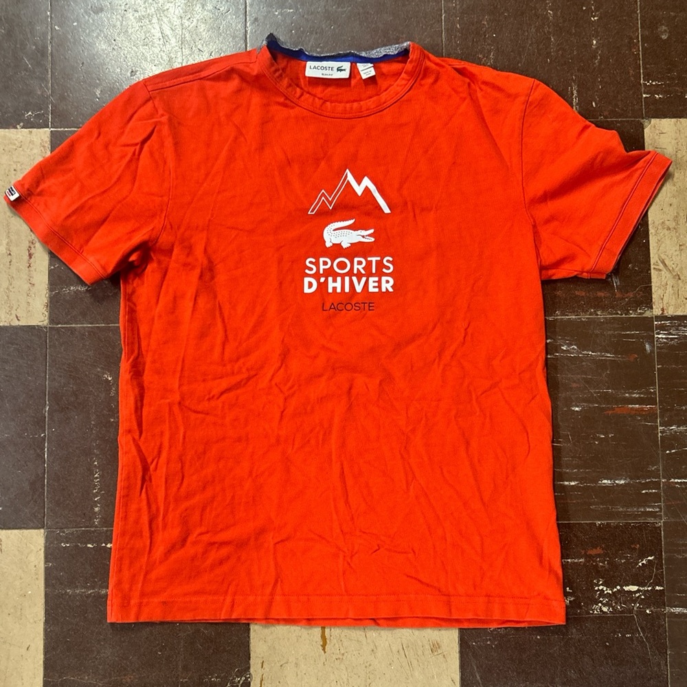 Orange lacoste winter sports tee